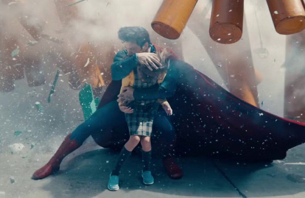 Superman shielding a little girl from falling rubble.