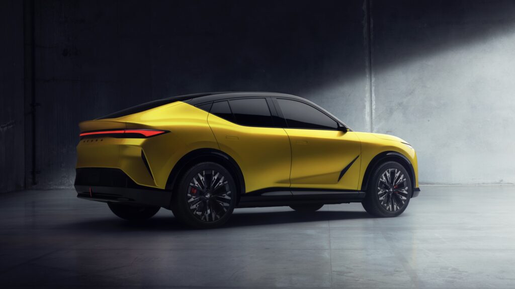 A yellow Acura RDX seen from the rear 3/4s