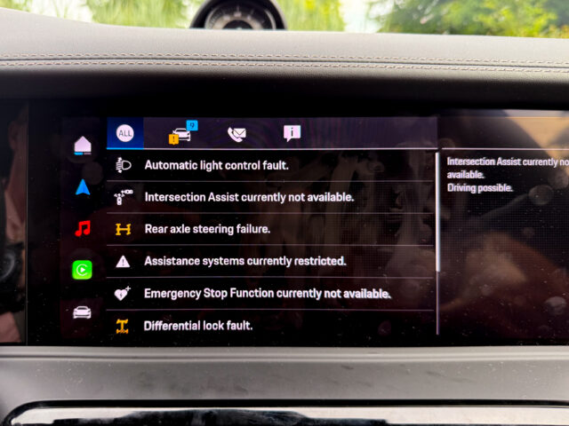 A Porsche infotainment screen showing a list of car error messages.