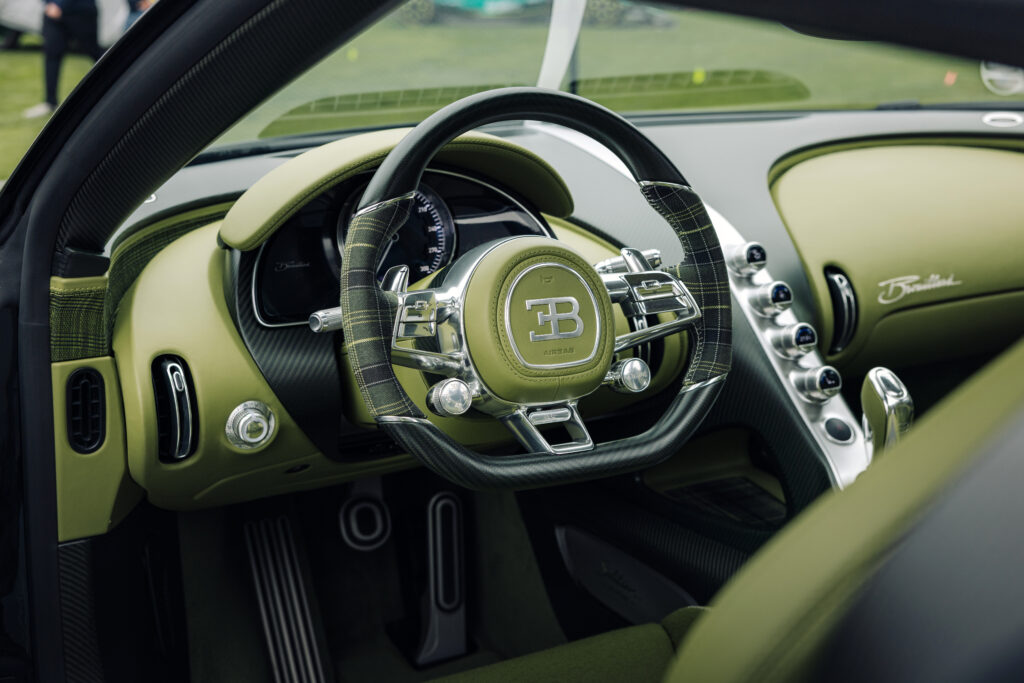 Bugatti Solitaire interior. The steering wheel has plaid trim around some of it.