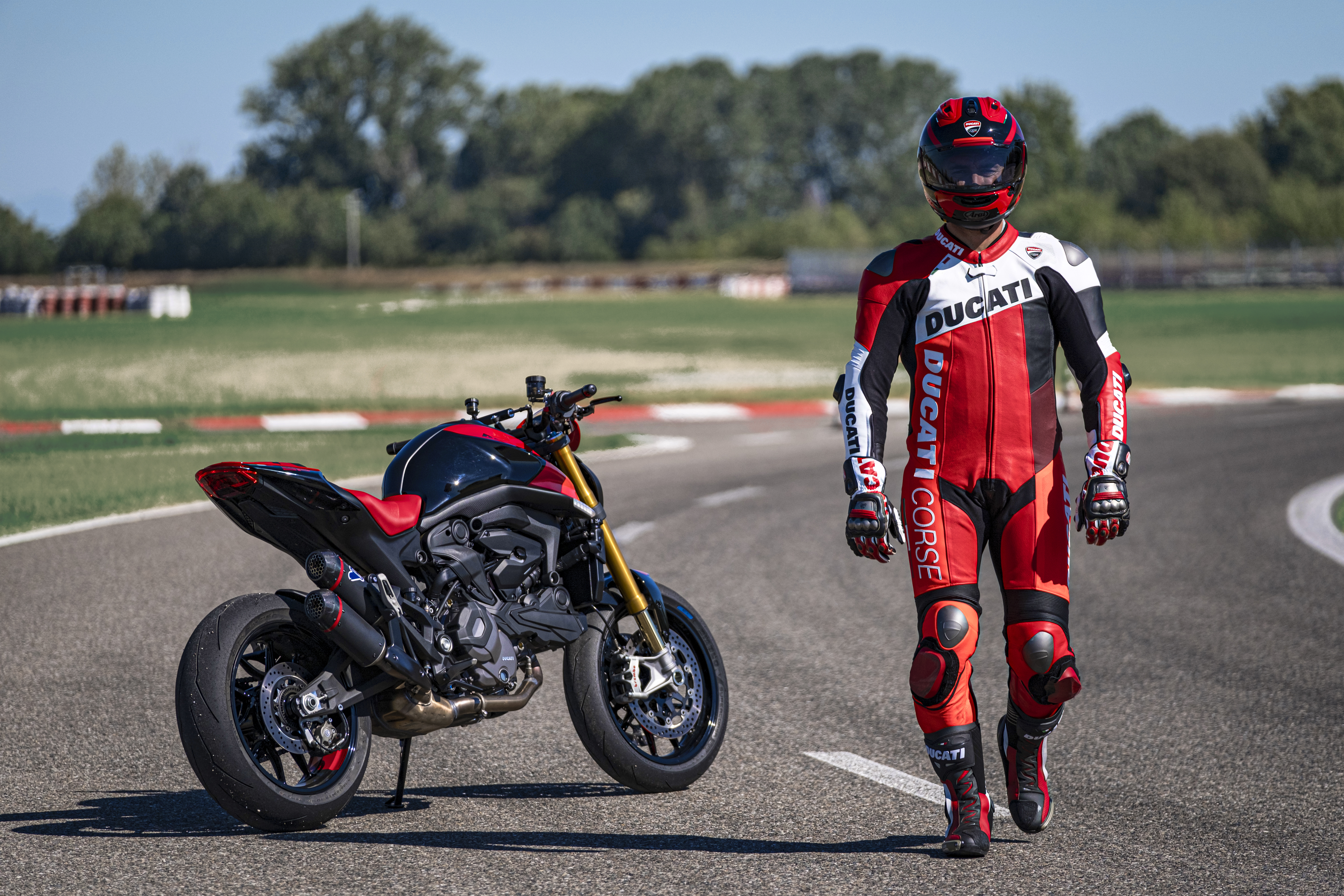 A man walks away from a Ducati Monster