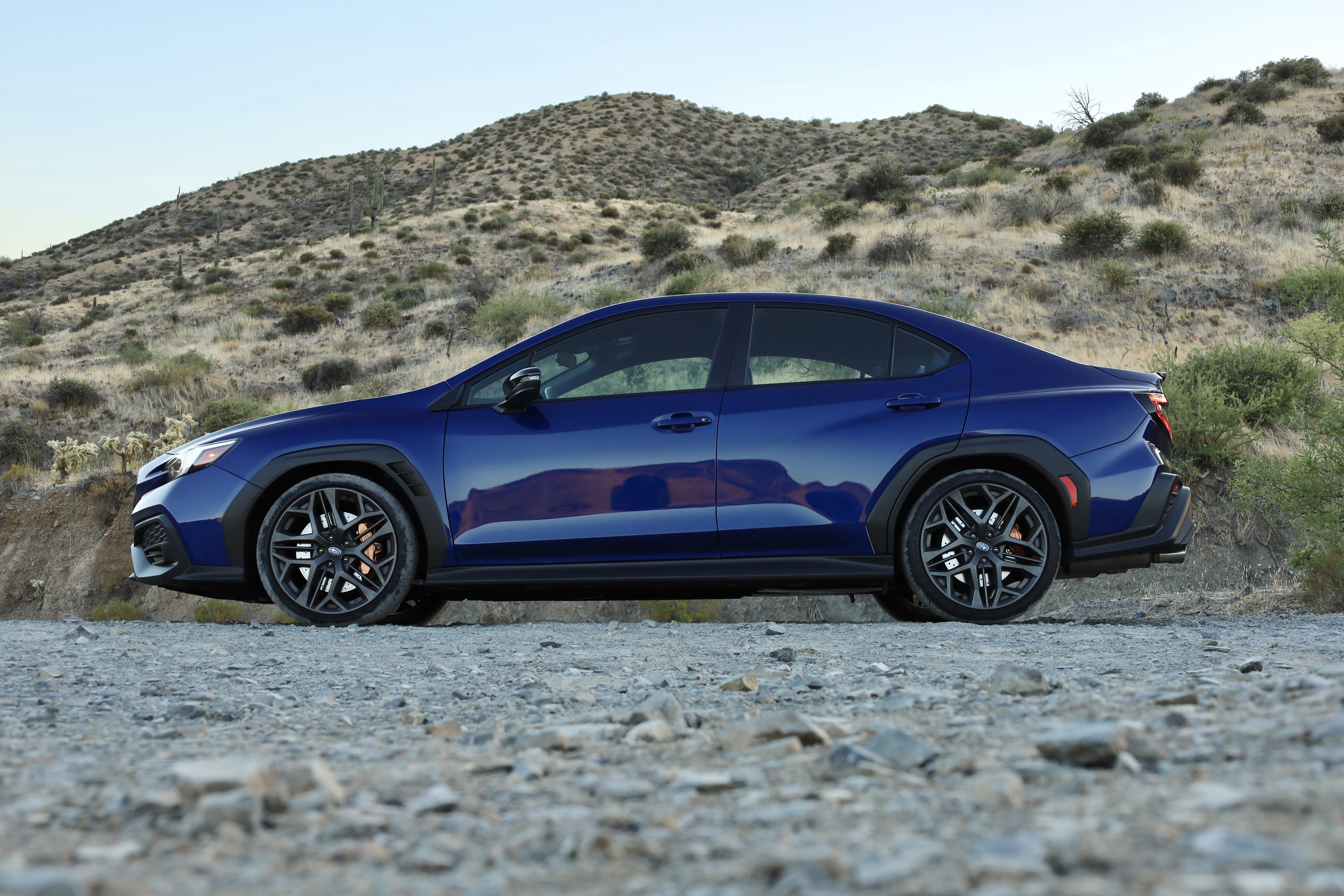 A blue Subaru WRX in profile