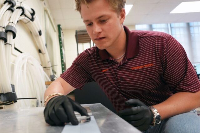 Graduate student Jack Tapocik sets up ice on an engineered surface in the VA Tech lab of Jonathan Boreyko