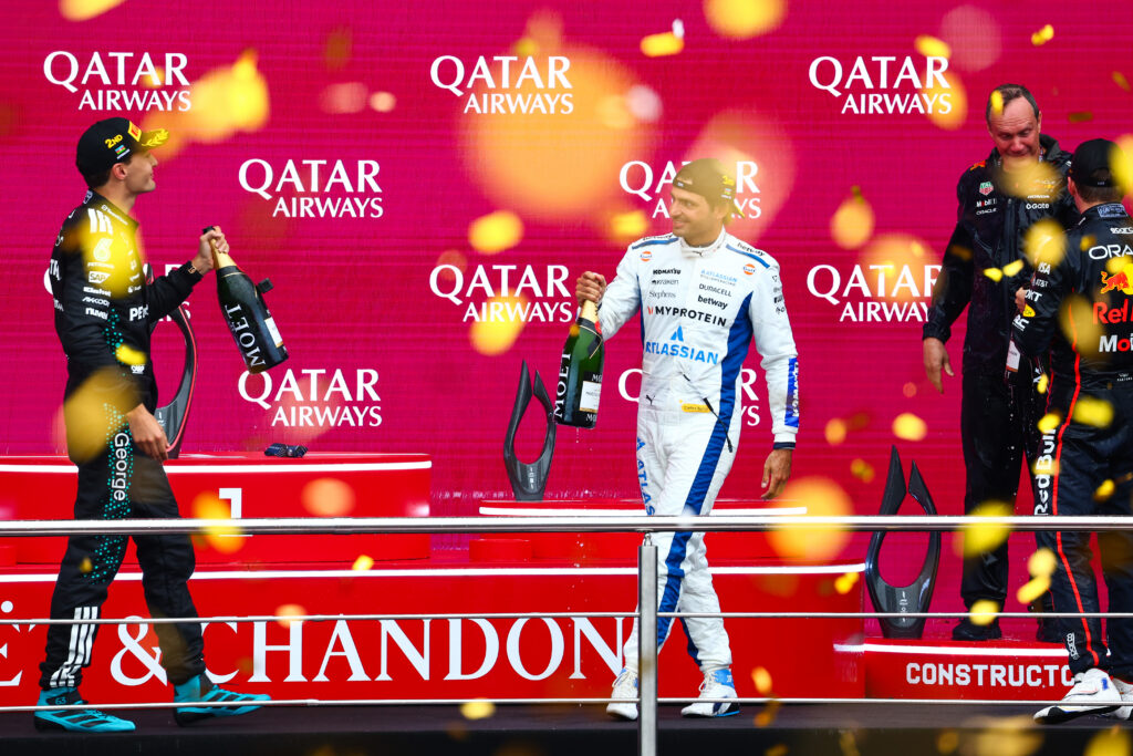 BAKU, AZERBAIJAN - SEPTEMBER 21: Race winner Max Verstappen of the Netherlands and Oracle Red Bull Racing Second placed George Russell of Great Britain and Mercedes AMG Petronas F1 Team Third placed Carlos Sainz of Spain and Williams and Paul Monaghan, Head of Car Engineering of Oracle Red Bull Racing celebrate on the podium with Champagne during the F1 Grand Prix of Azerbaijan at Baku City Circuit on September 21, 2025 in Baku, Azerbaijan.