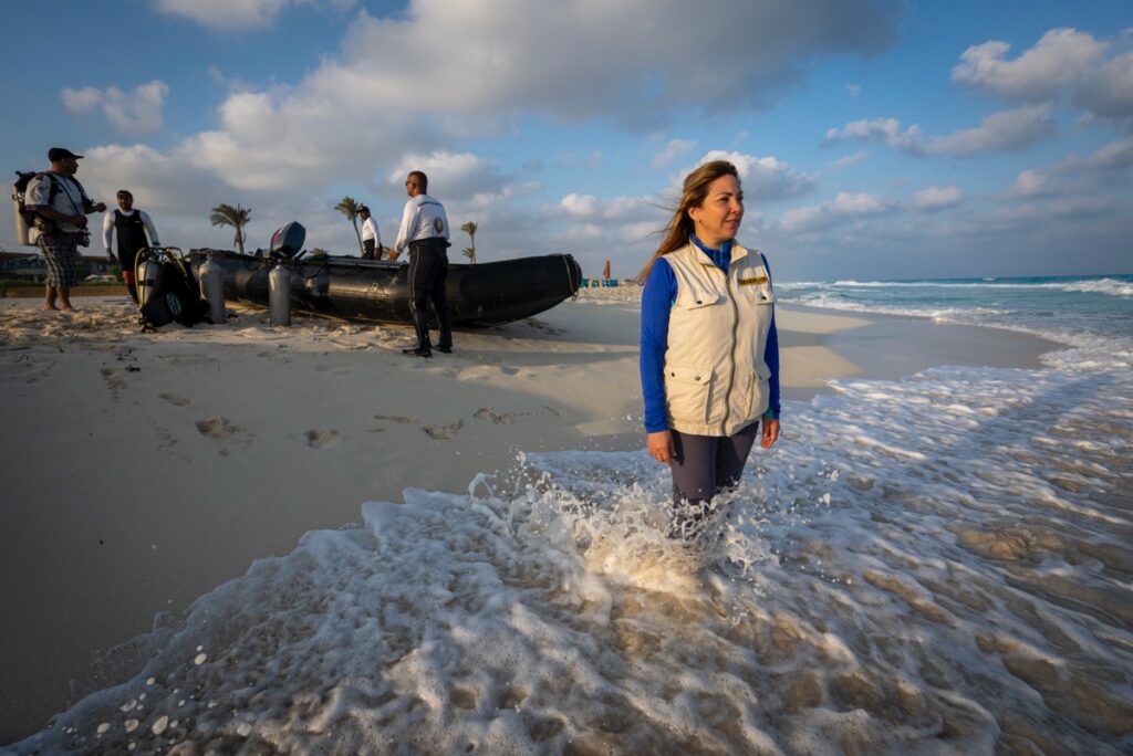 Martinez gazes out onto the water as divers prepare to search for evidence of manmade structures underwater.