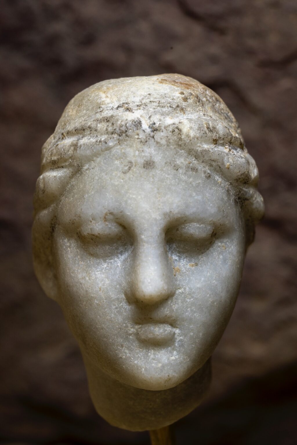 Close-up of one of the artifacts: a carved head believed to depict Cleopatra.