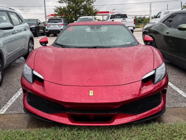 A ferrari 296 GTB seen head-on