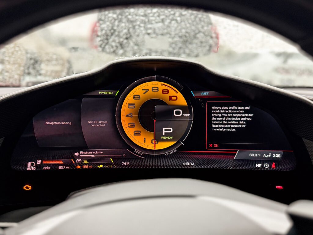 Ferrari 296 GTB driver display showing the native rev counter
