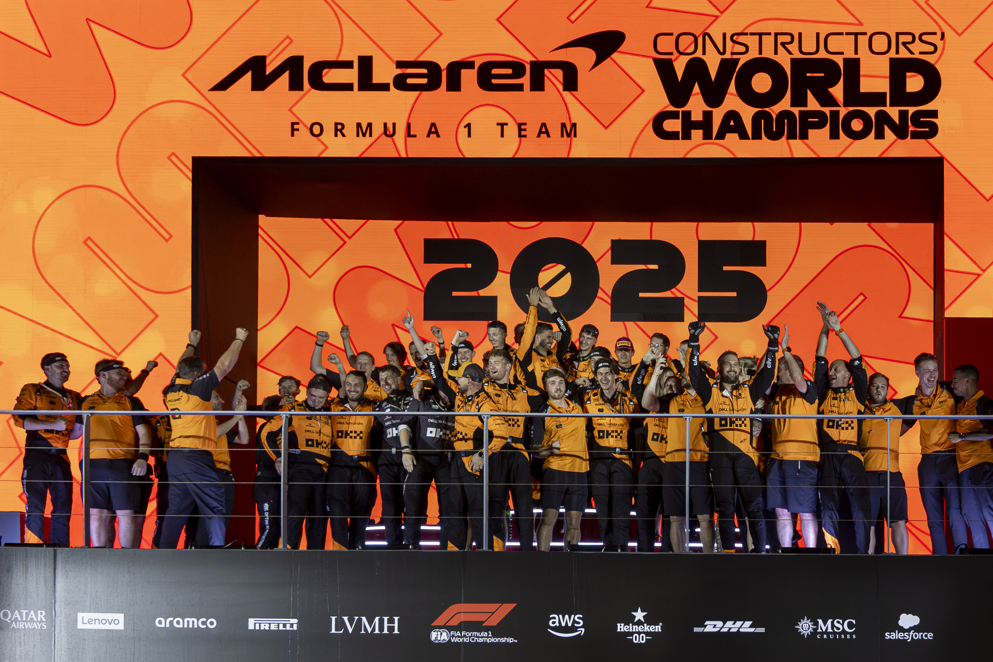 The McLaren F1 Team celebrates their Constructors' World Champion title on the podium at the Formula 1 Singapore Airlines Singapore Grand Prix in Marina Bay Street Circuit, Singapore, on October 5, 2025.