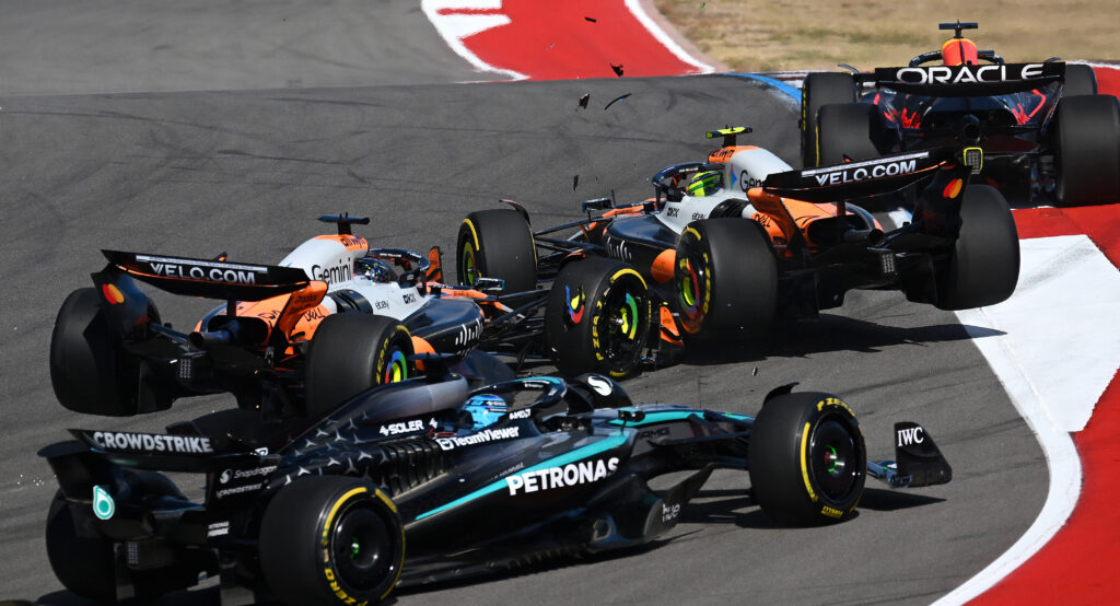 AUSTIN, TEXAS - OCTOBER 18: Oscar Piastri of Australia driving the (81) McLaren MCL39 Mercedes and Lando Norris of Great Britain driving the (4) McLaren MCL39 Mercedes crash at the start during the Sprint ahead of the F1 Grand Prix of United States at Circuit of The Americas on October 18, 2025 in Austin, Texas. (Photo by Clive Mason/Getty Images)