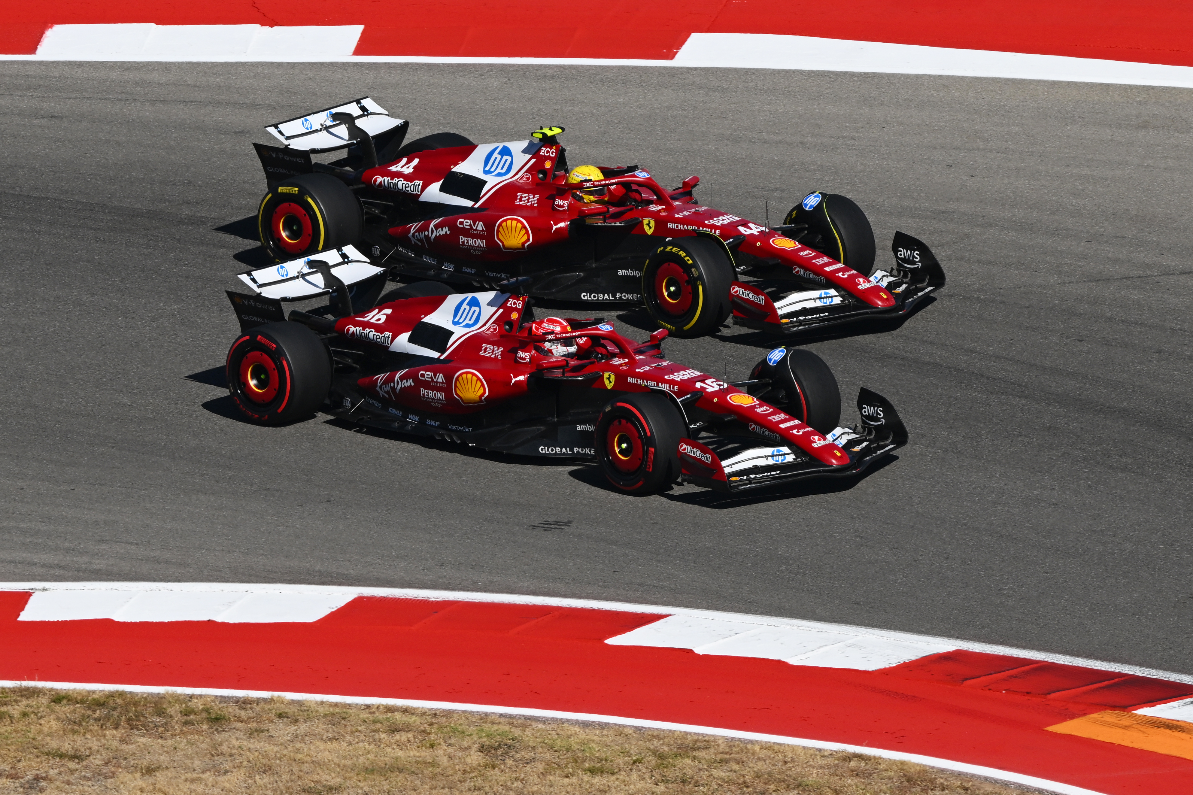AUSTIN, TEXAS - OCTOBER 19: Charles Leclerc of Monaco driving the (16) Scuderia Ferrari SF-25 and Lewis Hamilton of Great Britain driving the (44) Scuderia Ferrari SF-25 battle for track position during the F1 Grand Prix of United States at Circuit of The Americas on October 19, 2025 in Austin, Texas. (Photo by Clive Mason/Getty Images)