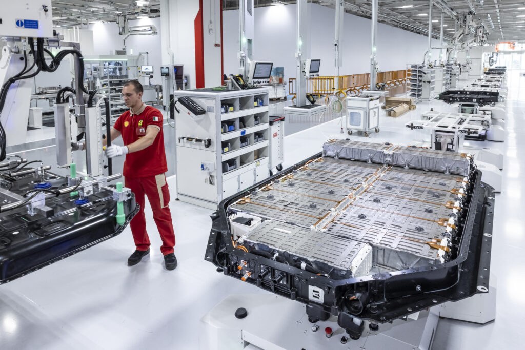 A Ferrari factory worker in the battery assembly area of the E-Building