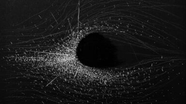 Lucas J. Rougeux, Light Particles against a Black Hole, 2021. Charcoal and acrylic on paper.