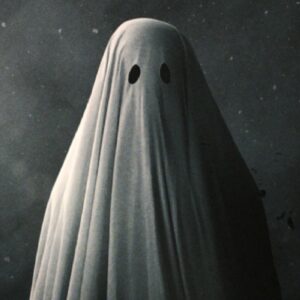 Poster art for 2017 film A Ghost Story featuring a figure draped in a white sheet with eye holes cut out