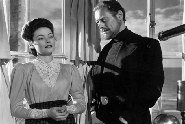 young woman and middle aged man standing and talking