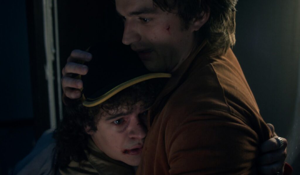 older young man comforting a younger one
