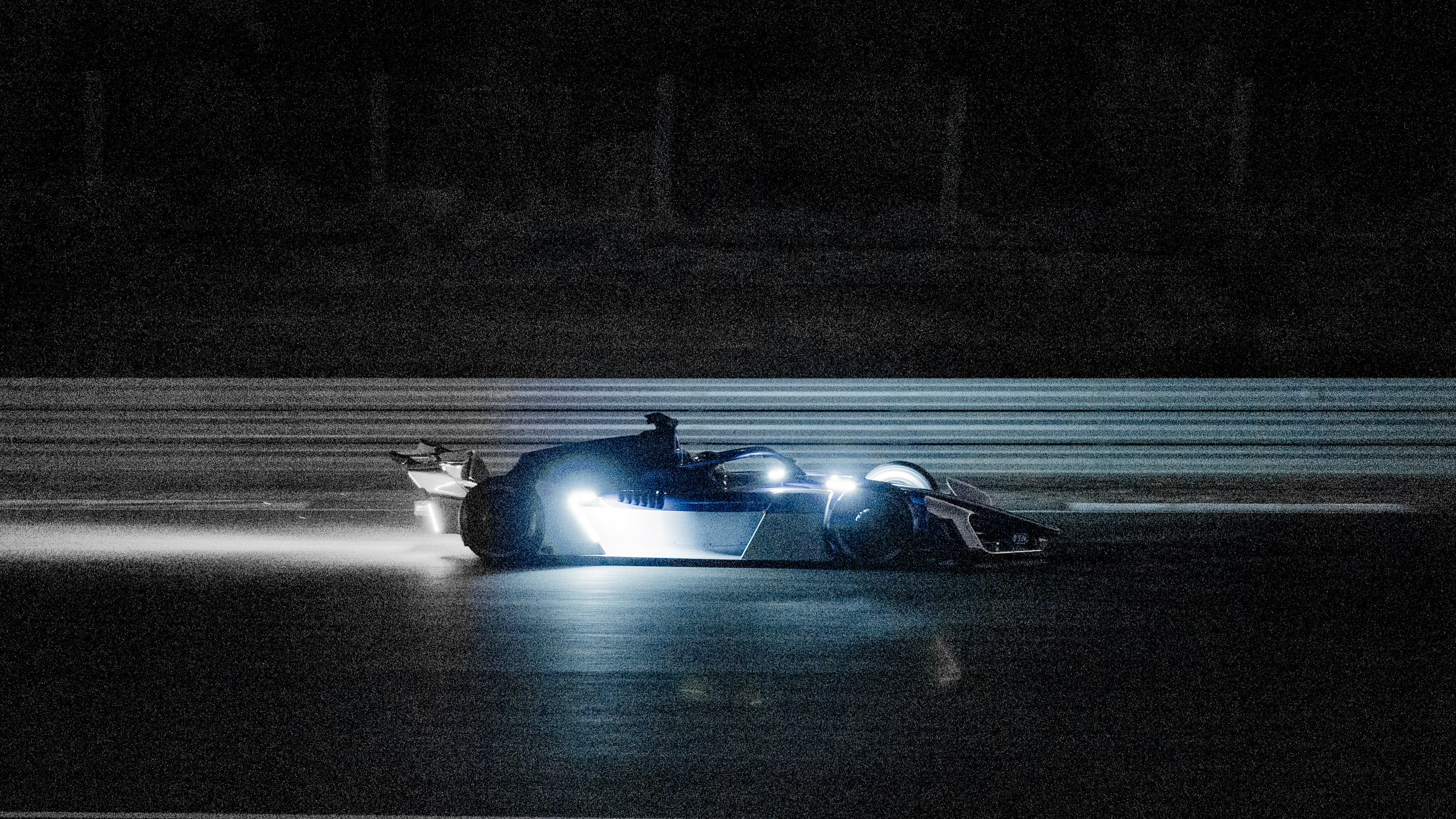 A grainy shot of a Formula E gen4 car testing