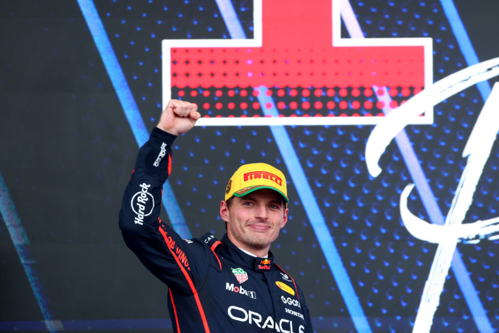 SAO PAULO, BRAZIL - NOVEMBER 09: Third placed Max Verstappen of the Netherlands and Oracle Red Bull Racing arrives on the podium during the F1 Grand Prix of Brazil at Autodromo Jose Carlos Pace on November 09, 2025 in Sao Paulo, Brazil. (Photo by Mark Thompson/Getty Images)