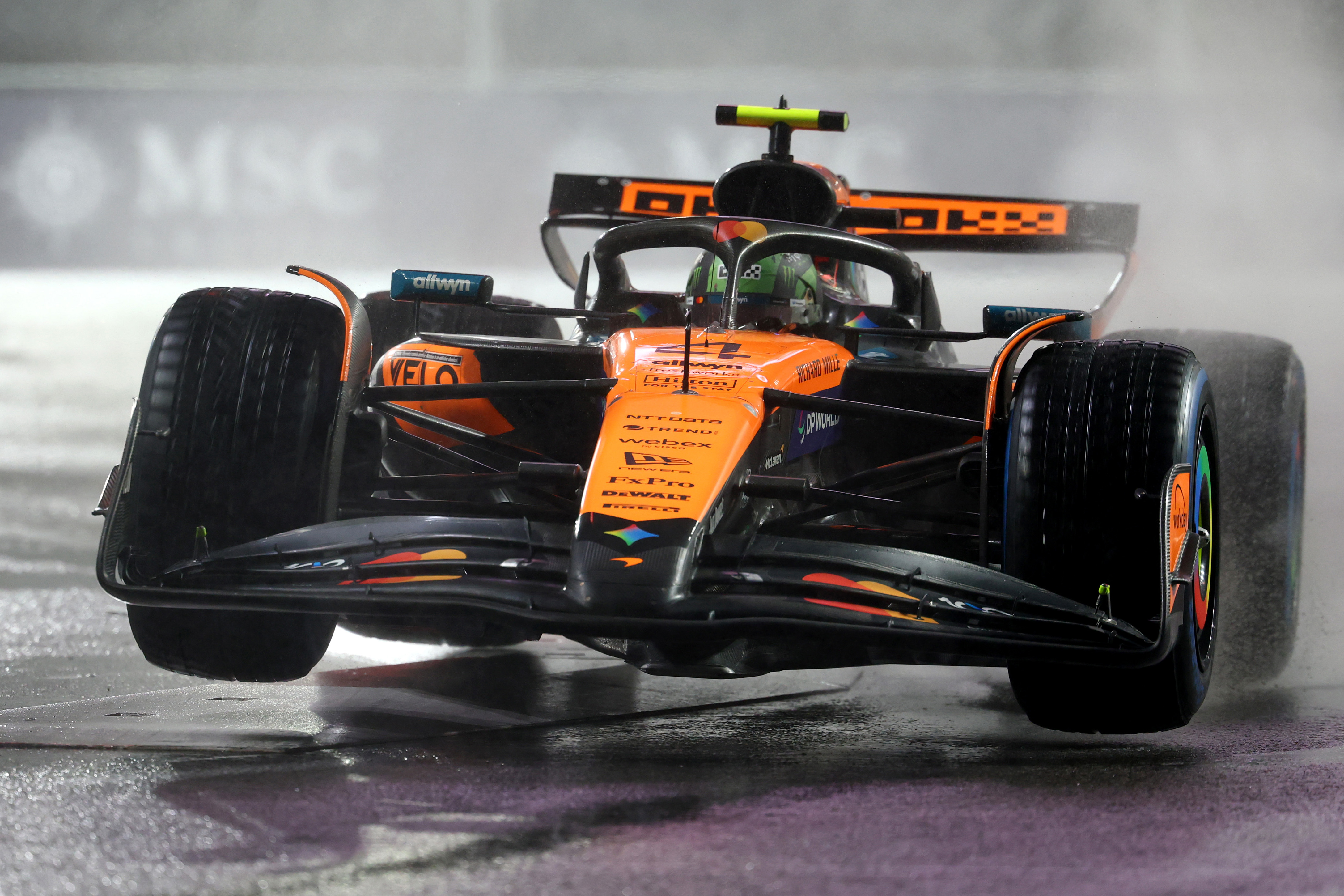 LAS VEGAS, NEVADA - NOVEMBER 21: Lando Norris of Great Britain driving the (4) McLaren MCL39 Mercedes lifts a wheel on track during qualifying ahead of the F1 Grand Prix of Las Vegas at Las Vegas Strip Circuit on November 21, 2025 in Las Vegas, Nevada. (Photo by )