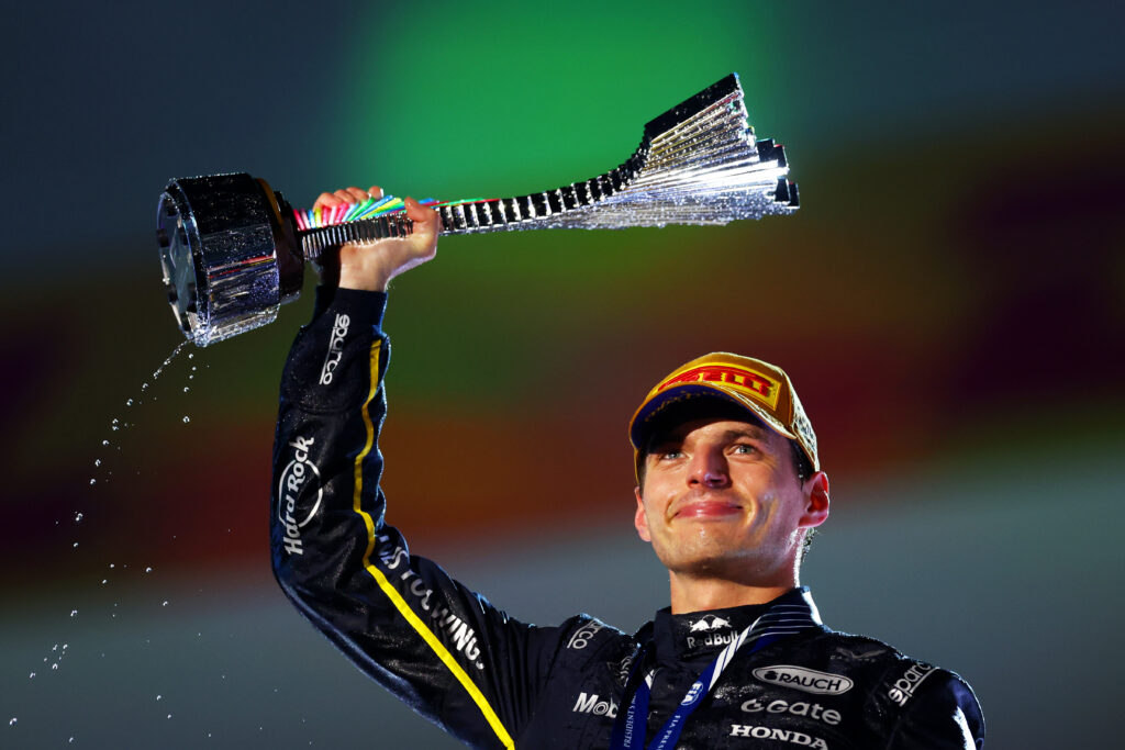 LAS VEGAS, NEVADA - NOVEMBER 22: Race winner Max Verstappen of the Netherlands and Oracle Red Bull Racing lifts his trophy on the podium during the F1 Grand Prix of Las Vegas at Las Vegas Strip Circuit on November 22, 2025 in Las Vegas, Nevada. (Photo by )