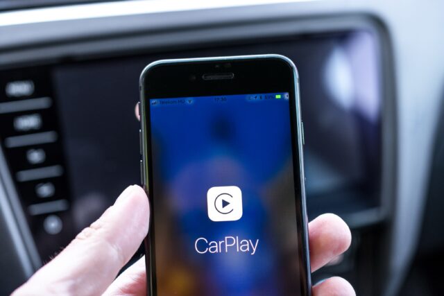 Miskolc, Hungary - May 20, 2018: Apple CarPlay starting up on an iPhone 8 connected to a new Skoda car.