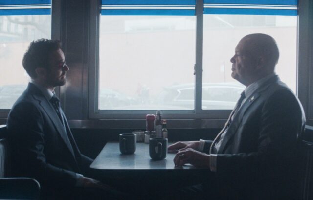 Matt Murdock and Wilson Fisk sitting across from each other in a diner