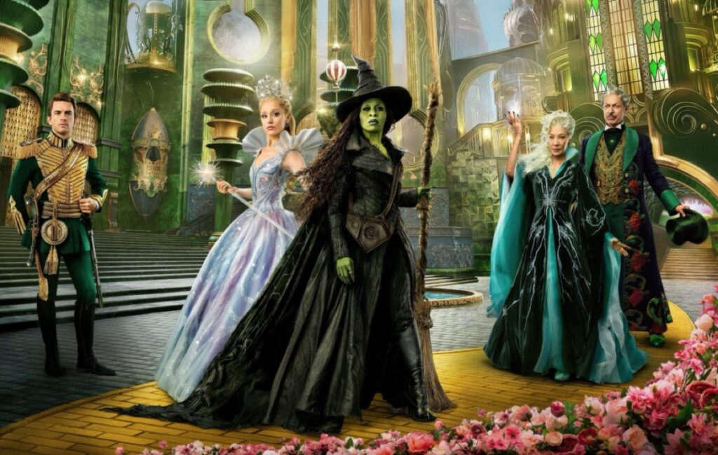 Glinda the Good Witch and Elphiba in center with supporting characters from Oz in either side