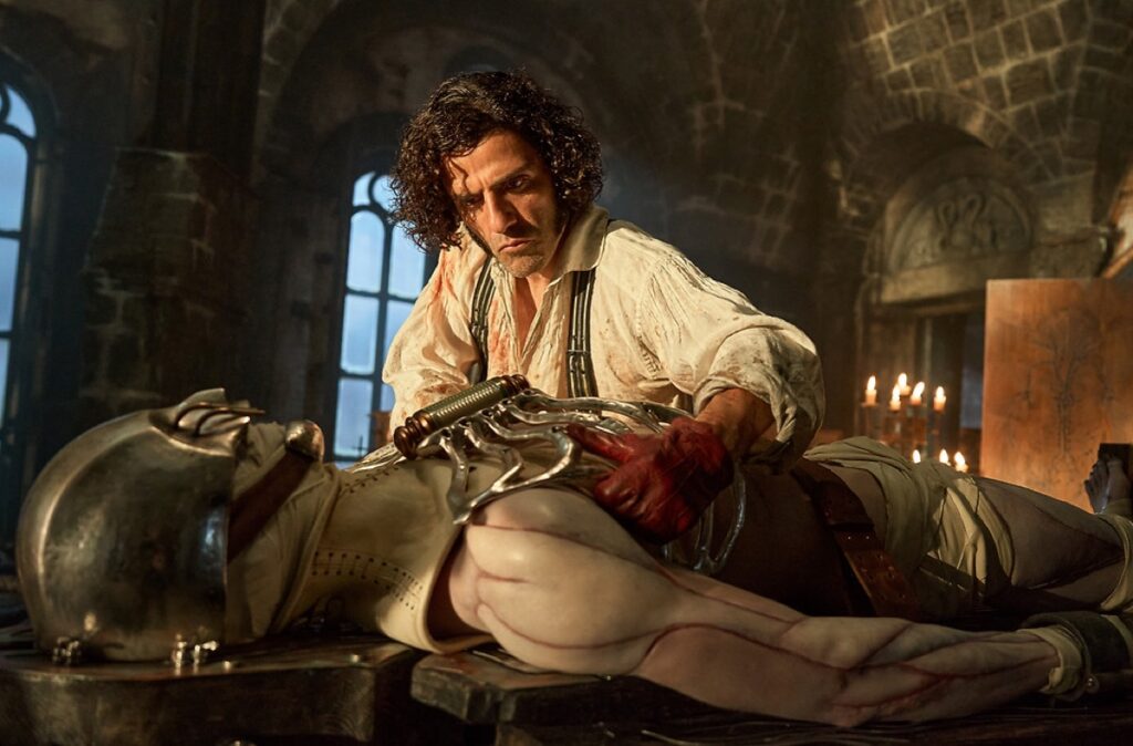 man in victorian garb in a lab bending over a body on a table