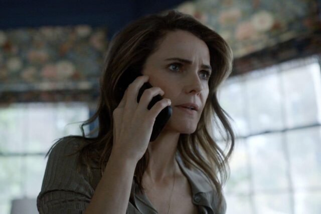 blonde woman on cell phone with a concerned look on her face