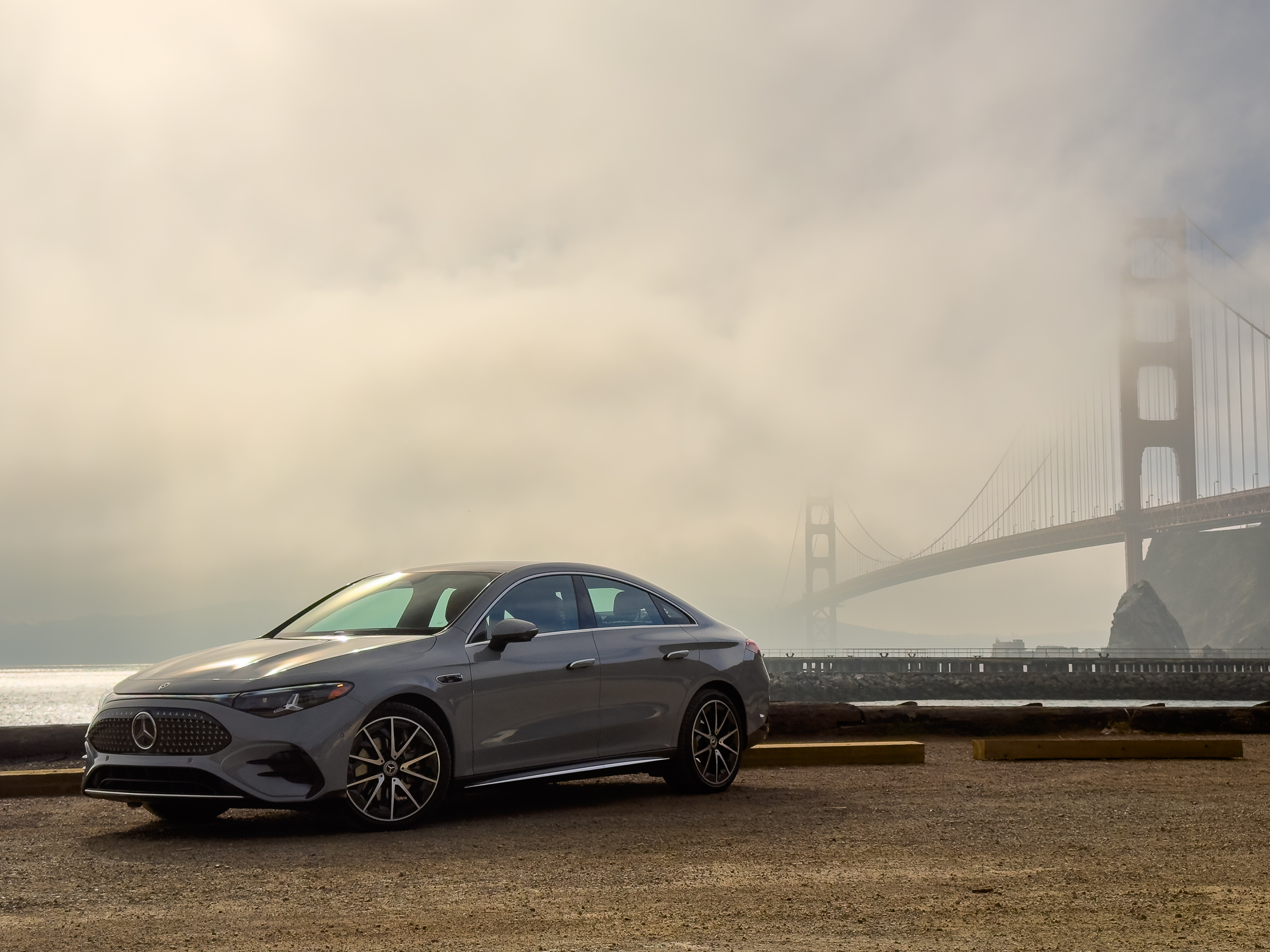 A Mercedes-Benz CLA parked in front of the golden gate bridge
