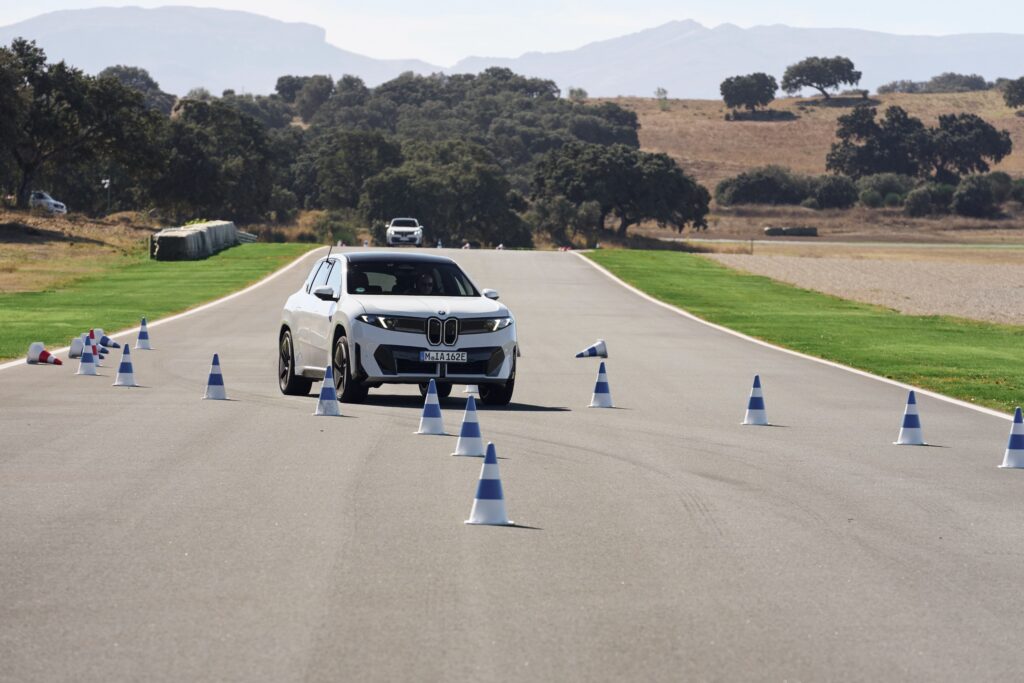 A BMW iX3 on track
