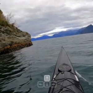 A first-person view from a canoe on a lake in an AI-generated video