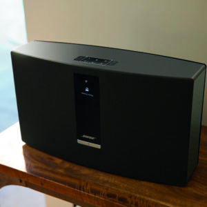 Bose SoundTouch 30 Series III on a wooden table.