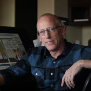 photo of Scott Adams at home with Dilbert in 2014.