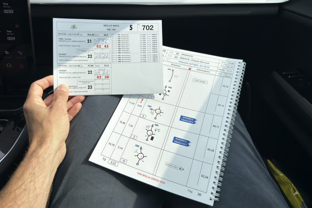 A man holds road rally directions.