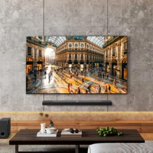 LG's 83-inch OLED B5 2025 TV. mounted onto a gray wall.