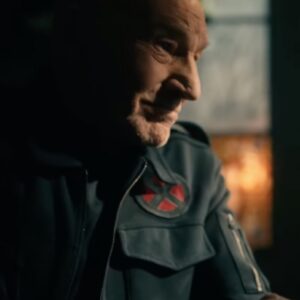 side view Patrick Stewart as Professor X looking at someone sitting across from him