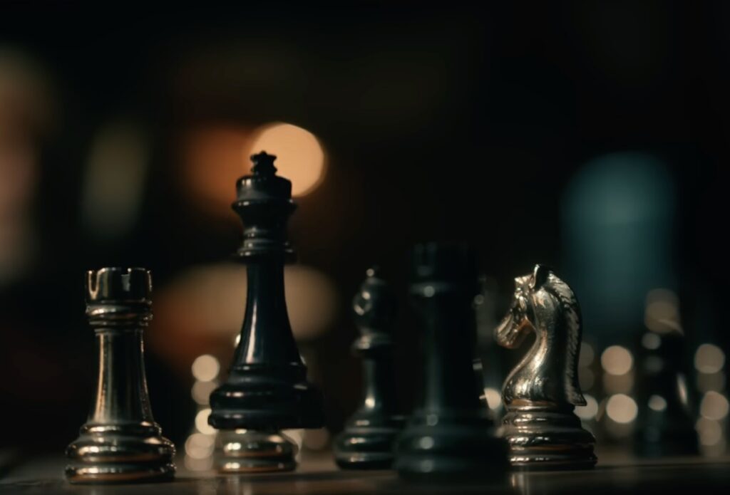 chess board with the queen piece levitating