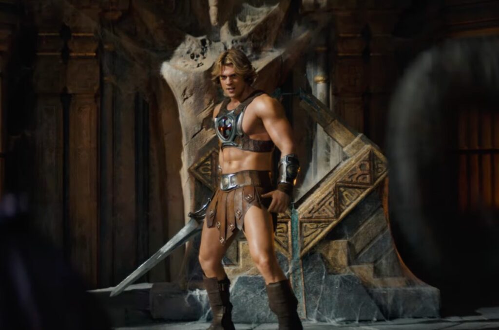 well muscled man in loin coth and a bit of chest armor holding a sword