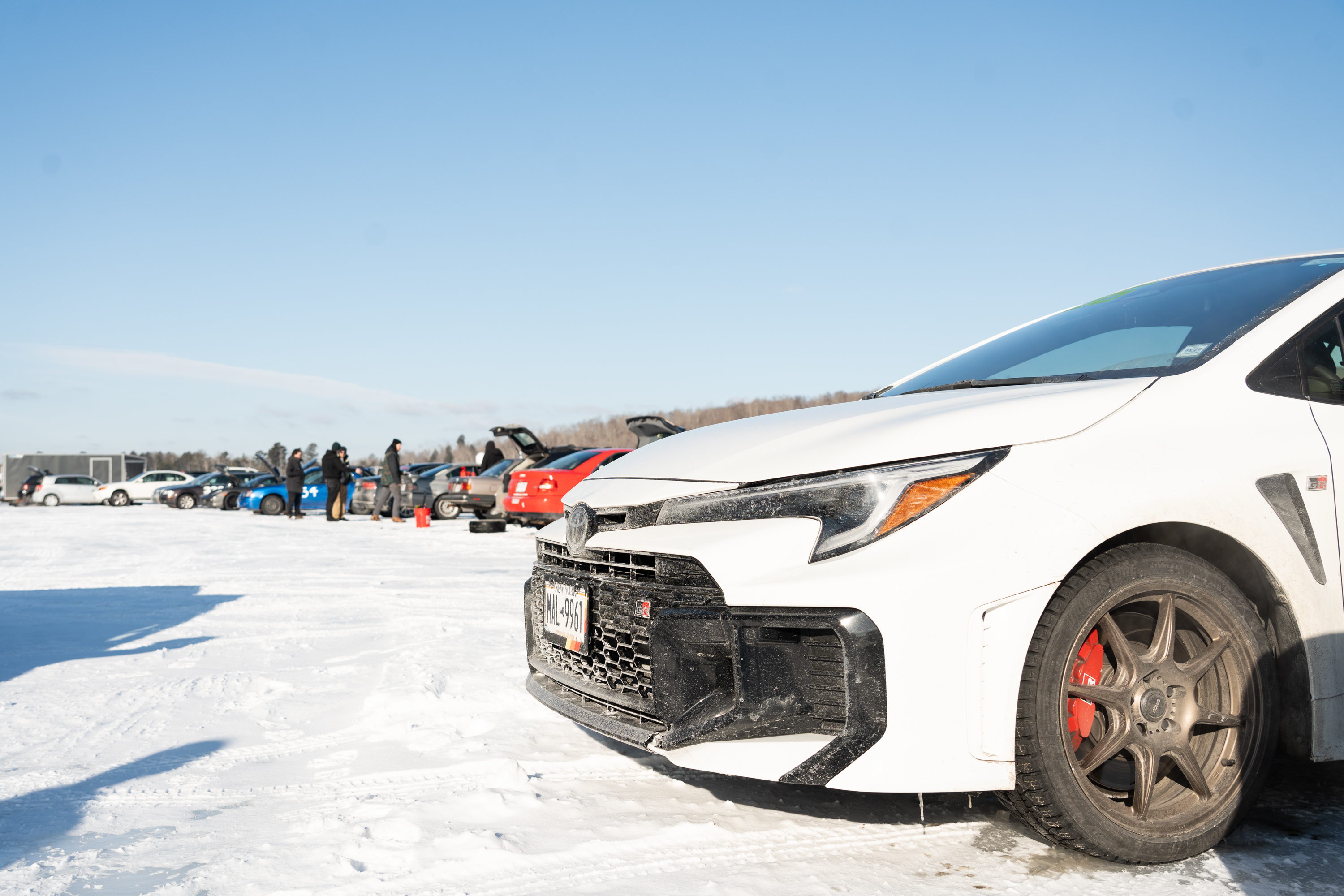 An array of cars lined up to go ice racing