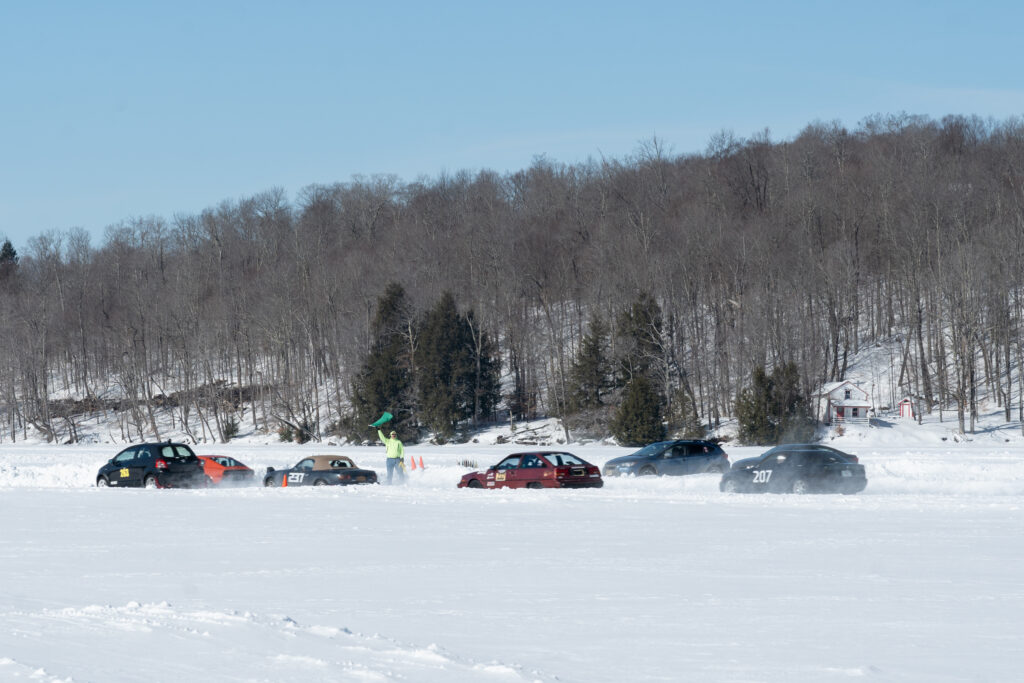 Cars racing on a frozen lake.