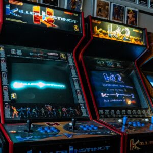 Killer Instinct arcade cabinets against a wall