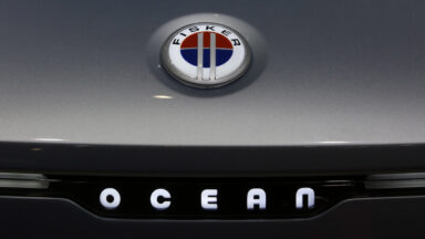 A badge on the hood of a Fisker Ocean electric sports utility vehicle (SUV) at the Fisker Inc. stand on the opening day of the MWC Barcelona at the Fira de Barcelona venue in Barcelona, Spain, on Monday, Feb. 28, 2022.