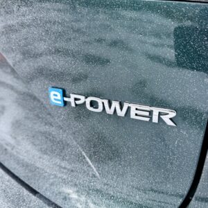 An E-Power badge on the back of a snow-frosted Nissan Qashqai tailgate.