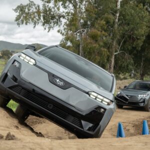 Subaru Uncharteds drive off road. The lead car is at a 45 degree side angle.