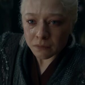 woman with white-blonde in Targaryen black garb, raising her tear stained face upward.