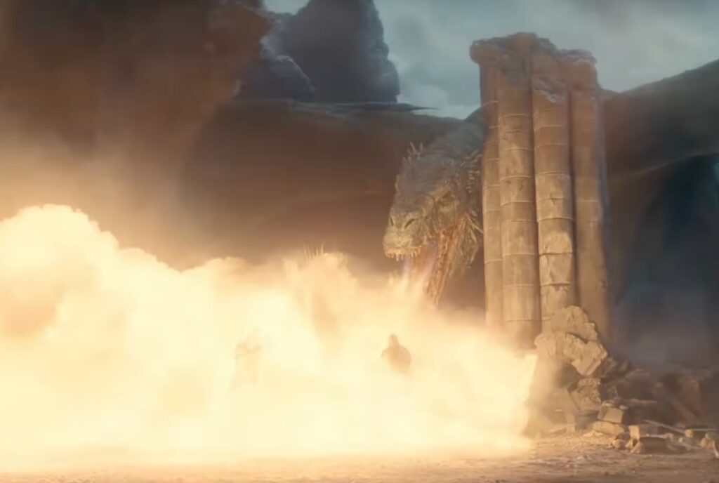 Gigantic dragon breathing plumes of fire onto soldiers in a medieval fantasy battlefield setting