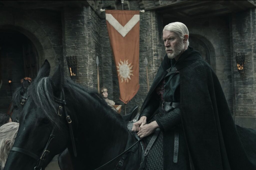 white-haired middle aged man on horseback