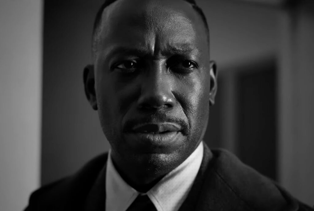closeup of a black man's face looking purposeful.