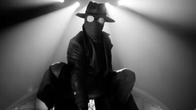 1930s era Spider-Man )or Spider-Noir) in crouched position in black and white.